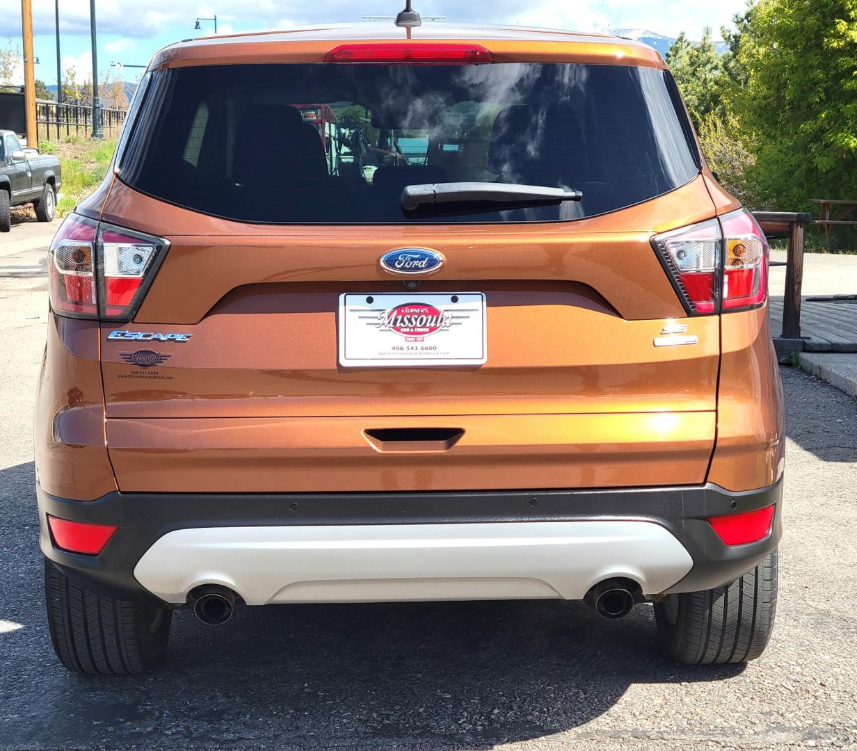 2017 Copper /Black Ford Escape SE (1FMCU9GD1HU) with an 1.5L I4 engine, 6 Speed Auto transmission, located at 450 N Russell, Missoula, MT, 59801, (406) 543-6600, 46.874496, -114.017433 - Nice Low Mile All Wheel Drive. Only 59K Miles. 1.5L I4 Engine. 6 Speed Automatic Transmission. Very Clean. Power drivers Seat. Air. Cruise. Tilt. Power Windows and Locks. Backup Camera. - Photo#7